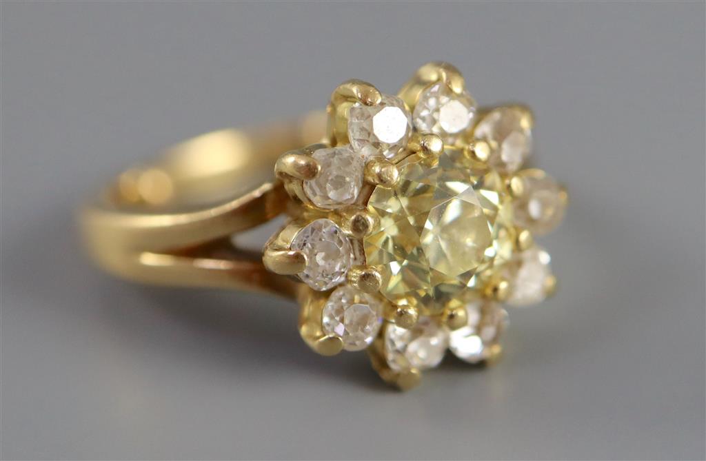 A modern 18ct gold and diamond cluster ring,